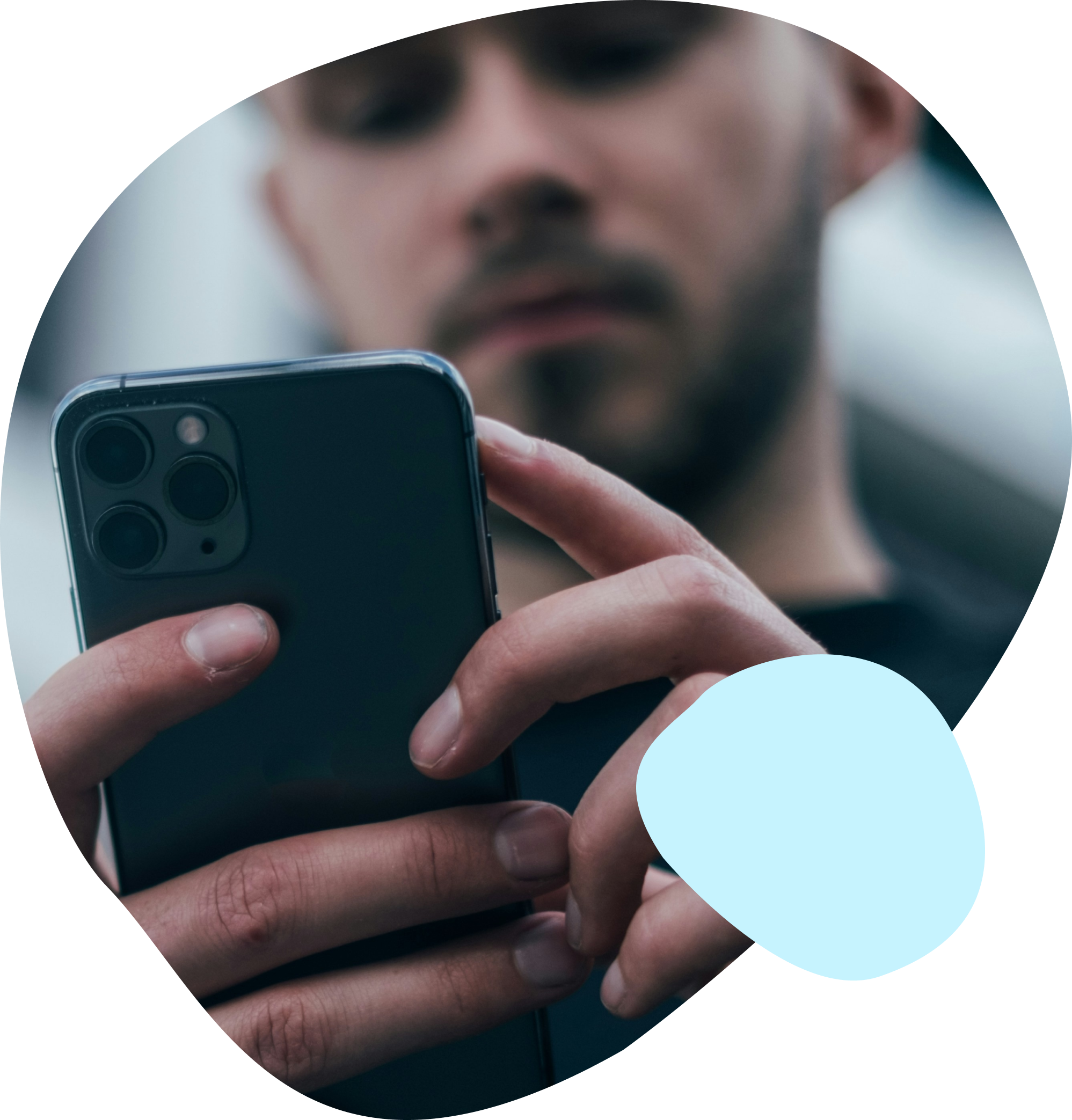 close up of a young male using a mobile phone