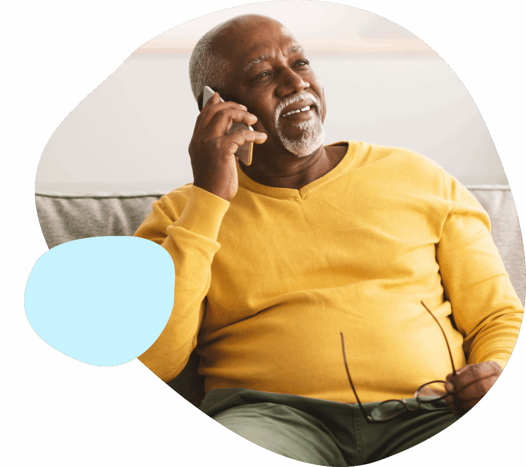 elderly man taking a phone call