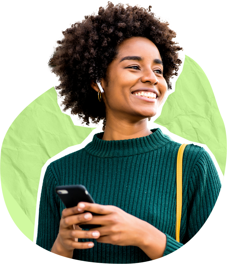 Smiling woman using mobile phone, turned away from camera